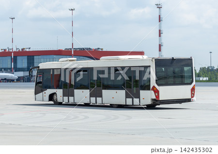 Airport shuttle bus near terminal Airport shuttle bus near terminal 142435302