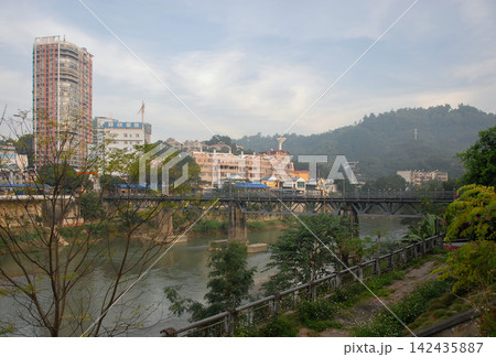Standing in Lao Cai, northern Vietnam, looking across the Nam Thi River to Hekou in China Standing in Lao Cai, northern Vietnam, looking across the Nam Thi River to Hekou in China 142435887