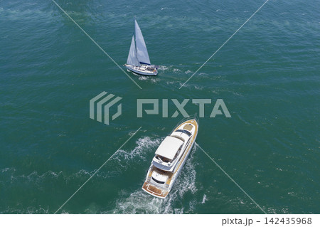 Yacht boat tour. Luxury boat yachting. Motorboat sailing at sea. Luxury private yacht in sea. Motor yacht luxury vessel. Boat motor aerial. Vacation on summer. Aerial view motorboat Yacht boat tour. Luxury boat yachting. Motorboat sailing at sea. Luxury private yacht in sea. Motor yacht luxury vessel. Boat motor aerial. Vacation on summer. Aerial view motorboat 142435968