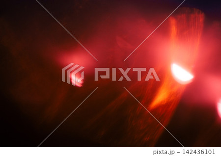 Red light effect on black background. Abstract wallpaper. Analog film effect. Blurred defocused. Lo-fi effect 142436101