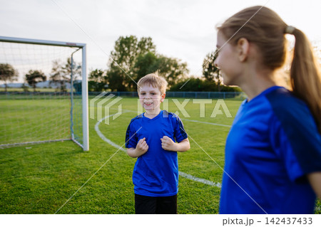 Young football team celebrating goal. Young football team celebrating goal. 142437433