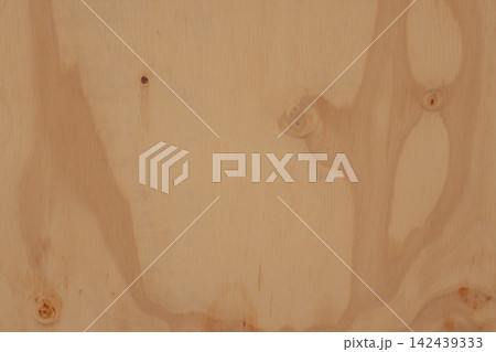 Plywood surface presenting a detailed natural wood grain texture with rustic brown knots. Organic and aged background suitable for various design and decorative applications 142439333