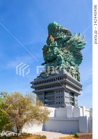 Landscape picture of old Garuda Wisnu Kencana GWK statues as Bali landmark with blue sky as a background. Balinese traditional symbol of hindu religion. Popular travel destinations in Indonesia. Landscape picture of old Garuda Wisnu Kencana GWK statues as Bali landmark with blue sky as a background. Balinese traditional symbol of hindu religion. Popular travel destinations in Indonesia. 142440496