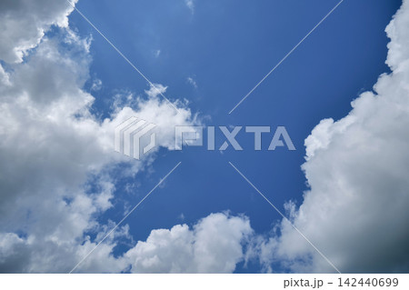 Blue Sky with Fluffy White Clouds 142440699