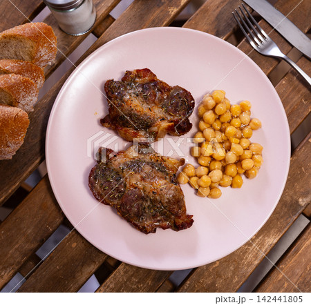 Cooked beef meat with chickpeas on a plate top view Cooked beef meat with chickpeas on a plate top view 142441805