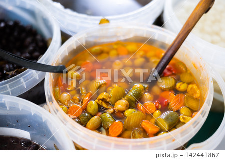 Green olives carrots and cucumbers pickled in barrels Green olives carrots and cucumbers pickled in barrels 142441867