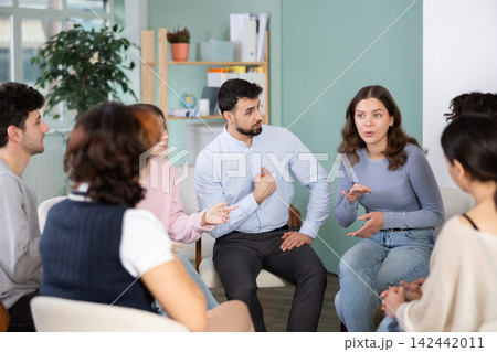 Group of students sitting in a circle and chatting Group of students sitting in a circle and chatting 142442011