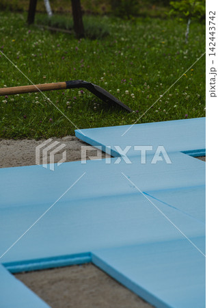 Preparing ground with XPS insulation for backyard pool installation 142443742