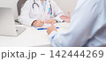 Doctor and patient having a medical consultation for blue and pink ribbon concept of October male Breast Cancer Awareness month, National Cancer Survivors Month and Pink October Healthcare 142444269