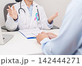Doctor and patient having a medical consultation for blue and pink ribbon concept of October male Breast Cancer Awareness month, National Cancer Survivors Month and Pink October Healthcare 142444271