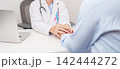 doctor hold patient hand to comfort and support with empathy. blue and pink ribbon concept of October male Breast Cancer Awareness month, National Cancer Survivors Month and Pink October Healthcare 142444272