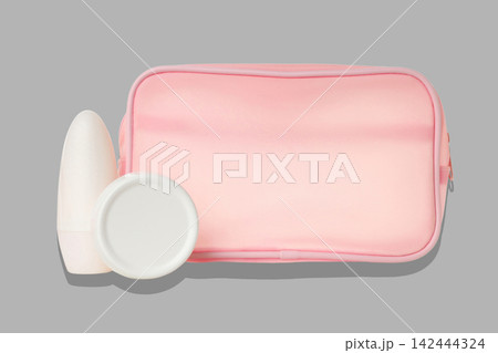 Cosmetics. Cosmetic toiletry bag positioned next to skincare products. Personal care concept Cosmetics. Cosmetic toiletry bag positioned next to skincare products. Personal care concept 142444324