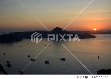 The beautiful sunrise on Padar Island in West Manggarai, Flores, Indonesia, with its reddish-yellow rays. The beautiful sunrise on Padar Island in West Manggarai, Flores, Indonesia, with its reddish-yellow rays. 142444832