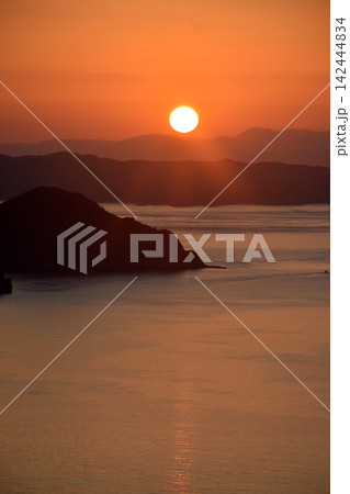 The beautiful sunrise on Padar Island in West Manggarai, Flores, Indonesia, with its reddish-yellow rays. The beautiful sunrise on Padar Island in West Manggarai, Flores, Indonesia, with its reddish-yellow rays. 142444834