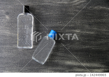 Antibacterial alcohol disinfectant gel 2 presentations on vintage gray background, covid prevention 142449903