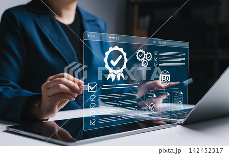 ISO certification and compliance audit management concept. Businesswoman reviewing checklists, approval documents, and quality verification, representing standards control and certification workflow. ISO certification and compliance audit management concept. Businesswoman reviewing checklists, approval documents, and quality verification, representing standards control and certification workflow. 142452317