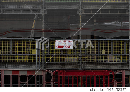 Construction site boundary with scaffolding and keep out sign Construction site boundary with scaffolding and keep out sign 142452372