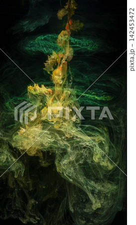 Green and yellow ink plumes swirling in dark liquid column with delicate filament textures 142453472