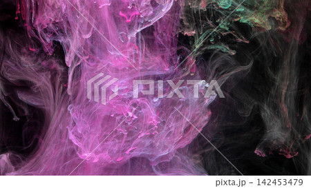 Pink and teal ink swirling through dark water, forming wispy plumes with soft gradients and flowing abstract texture Pink and teal ink swirling through dark water, forming wispy plumes with soft gradients and flowing abstract texture 142453479