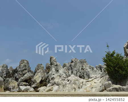 It is a landscape featuring strangely shaped rocks and cliffs. It is a landscape featuring strangely shaped rocks and cliffs. 142455852