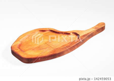 Handcrafted wooden serving paddle with natural grain and smooth finish 142459053