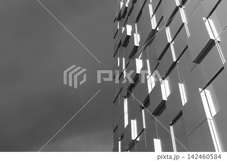 A modern geometric building facade photographed in black and white A modern geometric building facade photographed in black and white 142460584