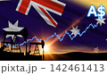 Pumpjacks work in the field during a golden sunset under the national flag. A glowing blue market line tracks rising Australian energy prices. 142461413