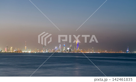 Skyline with Skyscrapers day to night timelapse in Kuwait City downtown illuminated at dusk. Kuwait City, Middle East Skyline with Skyscrapers day to night timelapse in Kuwait City downtown illuminated at dusk. Kuwait City, Middle East 142461835
