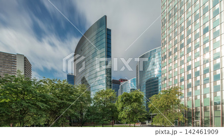 Timelapse panorama of modern office buildings. Glass skyscrapers with reflections and highlights 142461909