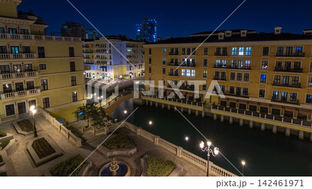 Canal aerial top view in Venice-like Qanat Quartier of the Pearl precinct of Doha day to night timelapse, Qatar. Canal aerial top view in Venice-like Qanat Quartier of the Pearl precinct of Doha day to night timelapse, Qatar. 142461971