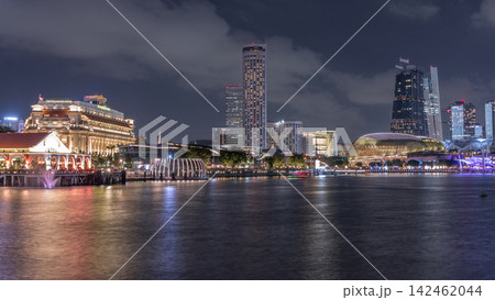 City skyline with skyscrapers and Esplanade Theatres on the Bay in Singapore at dusk, with beautiful reflection in water day to night timelapse City skyline with skyscrapers and Esplanade Theatres on the Bay in Singapore at dusk, with beautiful reflection in water day to night timelapse 142462044
