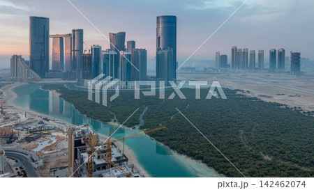 Buildings on Al Reem island in Abu Dhabi timelapse from above. Buildings on Al Reem island in Abu Dhabi timelapse from above. 142462074