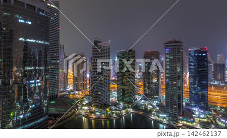 Residential and office buildings in Jumeirah lake towers district night timelapse in Dubai Residential and office buildings in Jumeirah lake towers district night timelapse in Dubai 142462137