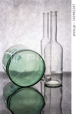 Still life with a red bottle and a glass bottle Still life with a red bottle and a glass bottle 142462167