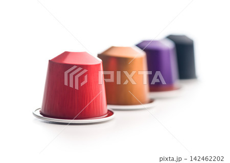 Colorful Coffee Capsules And Pods Scattered On White Background For Single-Serve Espresso Colorful Coffee Capsules And Pods Scattered On White Background For Single-Serve Espresso 142462202