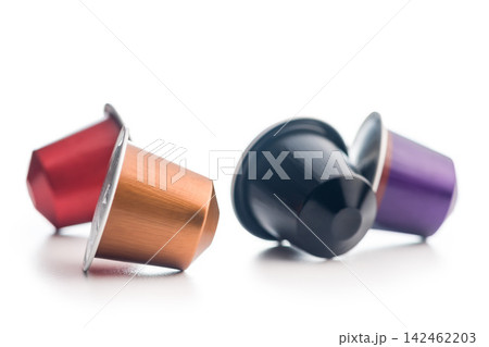 Colorful Coffee Capsules And Pods Scattered On White Background For Single-Serve Espresso Colorful Coffee Capsules And Pods Scattered On White Background For Single-Serve Espresso 142462203