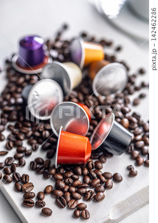Colorful Coffee Capsules on Roasted Coffee Beans for Espresso and Capsule Brewing 142462286