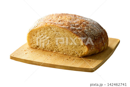 Sliced round of wheat rustic bread with sourdough, on cutting board , isolated on white background. Sliced round of wheat rustic bread with sourdough, on cutting board , isolated on white background. 142462741
