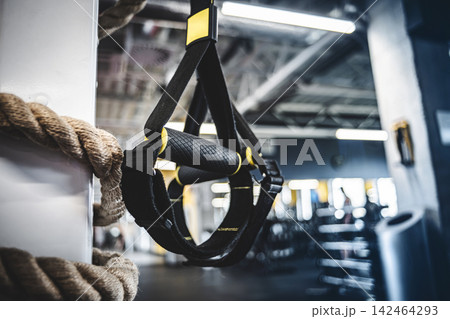 TRX Suspension Trainer Hanging In A Gym TRX Suspension Trainer Hanging In A Gym 142464293
