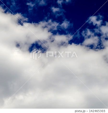 dense cumulus clouds cover the lower part of the deep blue sky dense cumulus clouds cover the lower part of the deep blue sky 142465303