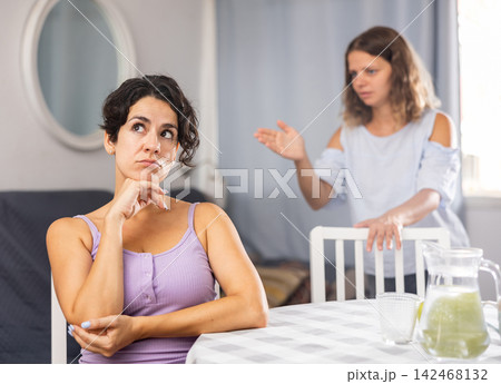 Young female LGBT couple arguing at home Young female LGBT couple arguing at home 142468132