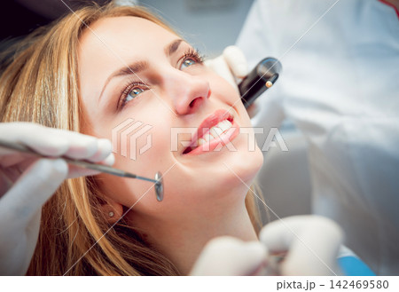 Young smiled woman at the dentist Young smiled woman at the dentist 142469580
