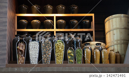 Ceramic fermentation jars with cutaway cross-sections of preserved food Ceramic fermentation jars with cutaway cross-sections of preserved food 142471491