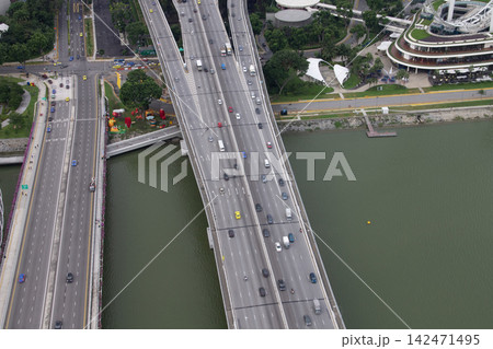 Aerial view of a multi-lane elevated highway bridge over water 142471495