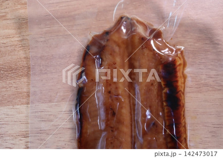 Marinated Meat in Plastic Bag on Wooden Surface Marinated Meat in Plastic Bag on Wooden Surface 142473017