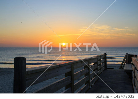 Sunrise Over Corolla Beach in North Carolina With Wooden Walkway Sunrise Over Corolla Beach in North Carolina With Wooden Walkway 142478032