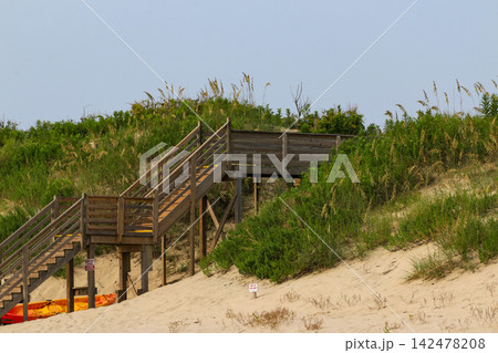 Wooden Stairs over Snad Dunes Lead to the Beach in Corolla North Carolina Wooden Stairs over Snad Dunes Lead to the Beach in Corolla North Carolina 142478208