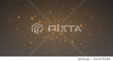 Golden particles scattering on a dark background, forming a beautiful abstract light effect 142479284