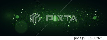 Green particles and bokeh lights creating a dark abstract background with a festive glow 142479285