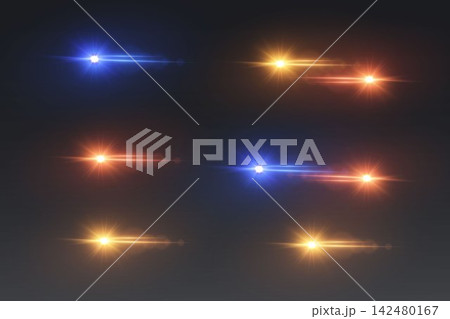 Multiple colorful light sources creating lens flares and streaks on a dark background 142480167